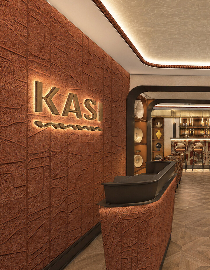Kasi restaurant entrance with gold KASI signage on a rusted metal wall